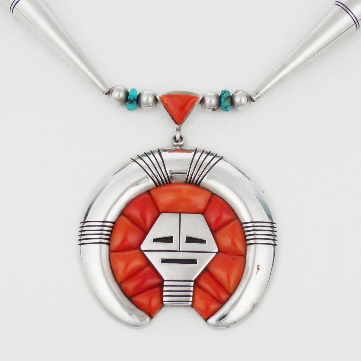 An exquisite necklace by renowned Navajo jewelry Harvey Begay, this piece features exquisite height coral inlay, carefully hand-cut and perfectly placed. Turquoise nuggets, inlaid coral and handmade silver beads complete the necklace. 
Measures: