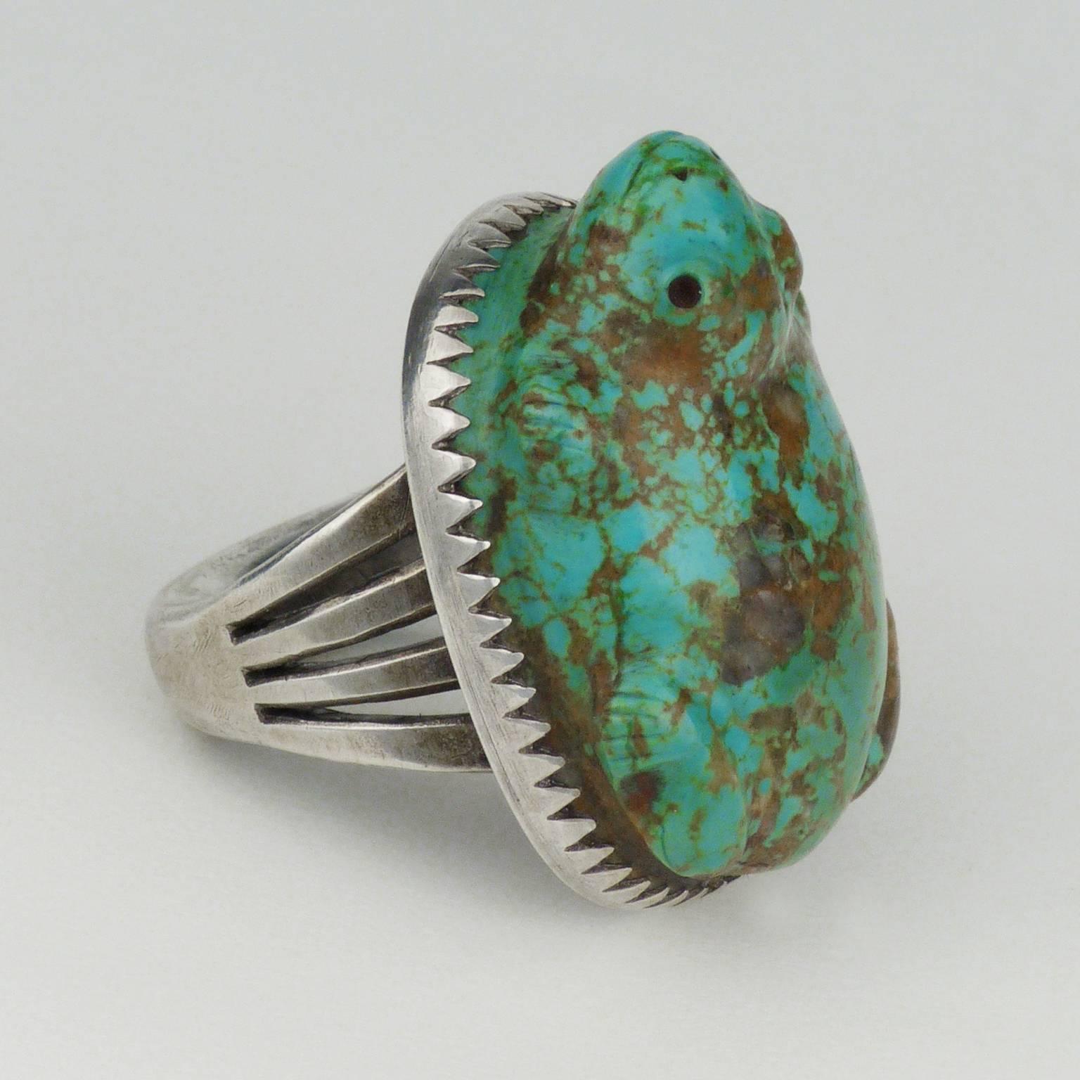 A hand-carved frog in natural turquoise set in a handmade ingot silver setting. The frog is carved by Zuni master Leekya Deyuse (1889-1966) from natural American turquoise. The setting was crafted by modern master silversmith Steven Tiffany from