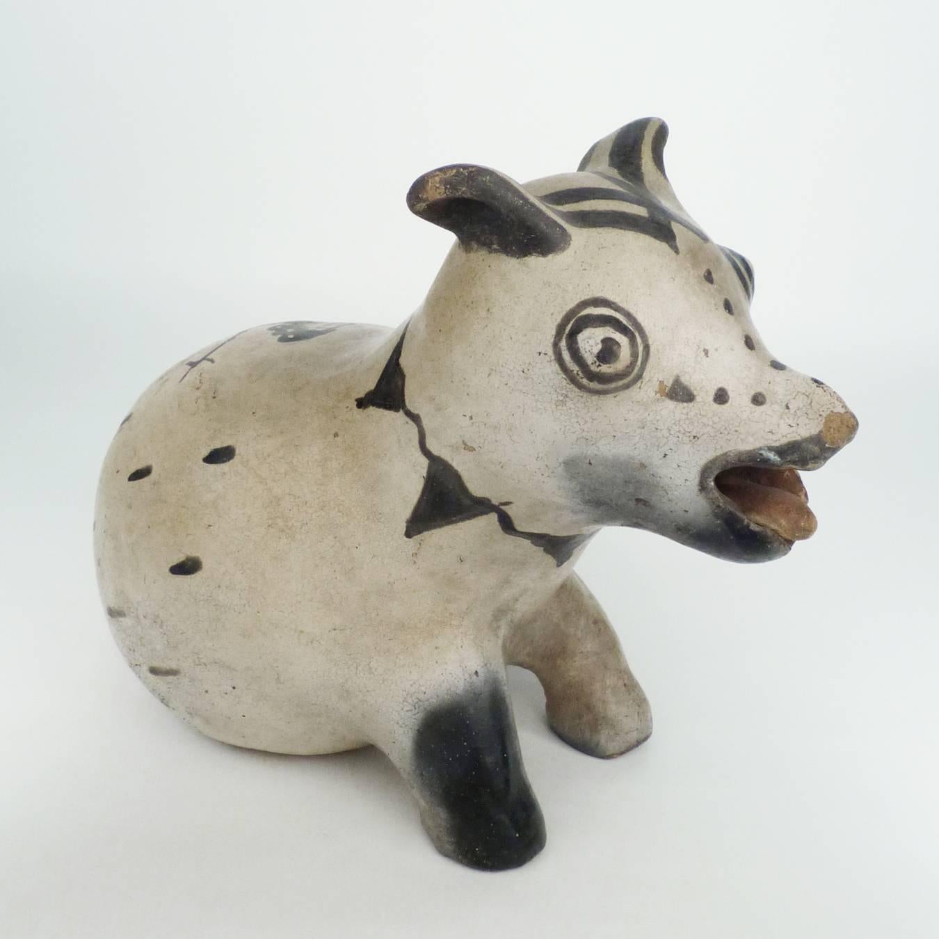 An expressive and unusual representation of a small dog. At the turn of the century, Cochiti Puebo potters extended their repertoire from traditional ollas to figural works. Many pieces captured imagery of visitors to the pueblo, such as opera