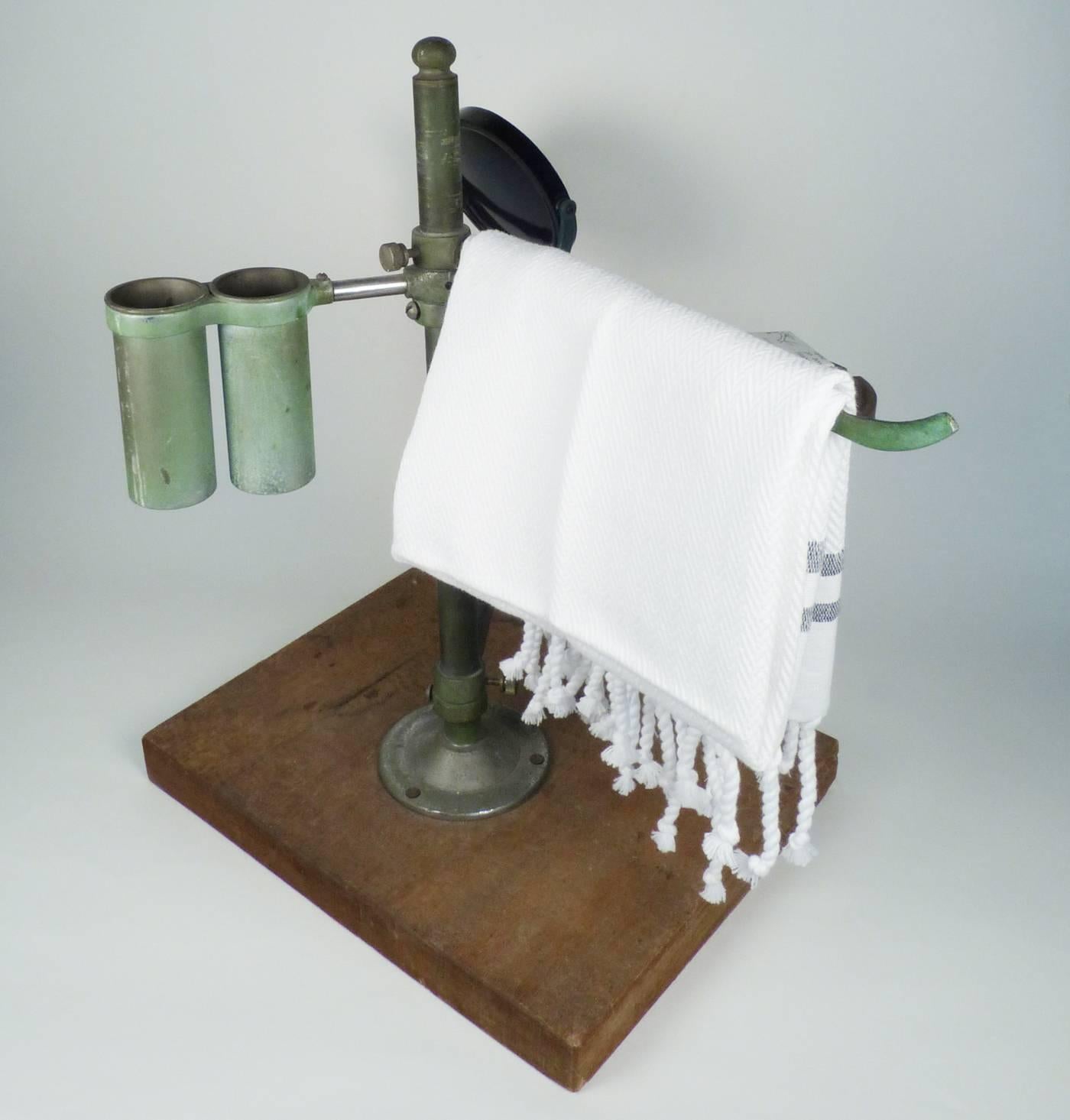 A vintage Industrial piece that will transform any toilette. Toothbrush holder, shaving mirror, towel rack and soap dish, all with wonderful patina and utilitarian design. Measures: 17" x 12" x 17".