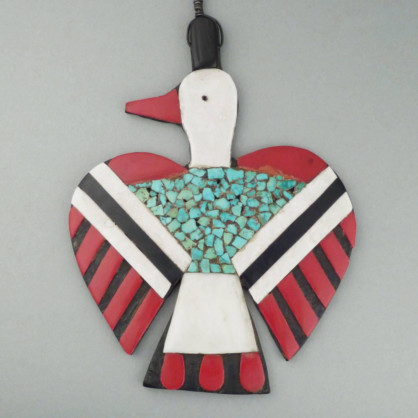 Beginning in the 1920s, the artists of Kewa (formerly known as Santo Domingo Pueblo) began making jewelry using a variety of found and recycled materials including turquoise chips, plastic, car battery casings and vinyl records.
This unusually