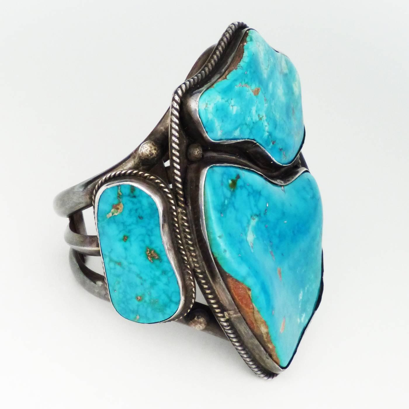 Exquisite blue gem turquoise and silver cuff by one of the master Navajo jewelers. This bracelet is clearly hallmarked on the back. Measures: 5 5/8