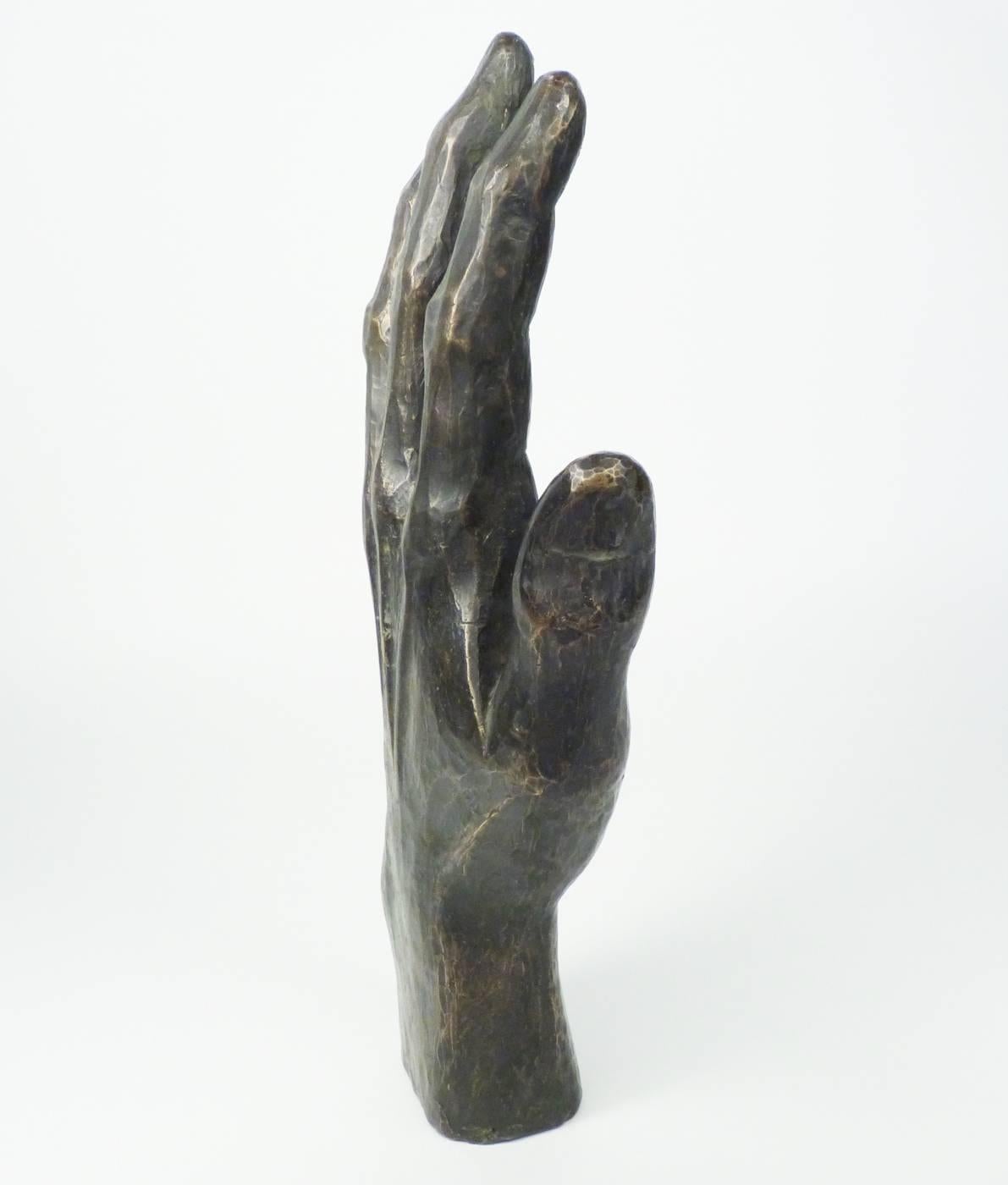Ben Rouzie (1922-2016), a city planner in Winston-Salem, dedicated his free time to creating free-form wood vessels and cast bronze pieces. This slightly larger than life hand stands or can be mounted on the wall.
Measures: 10 3/4