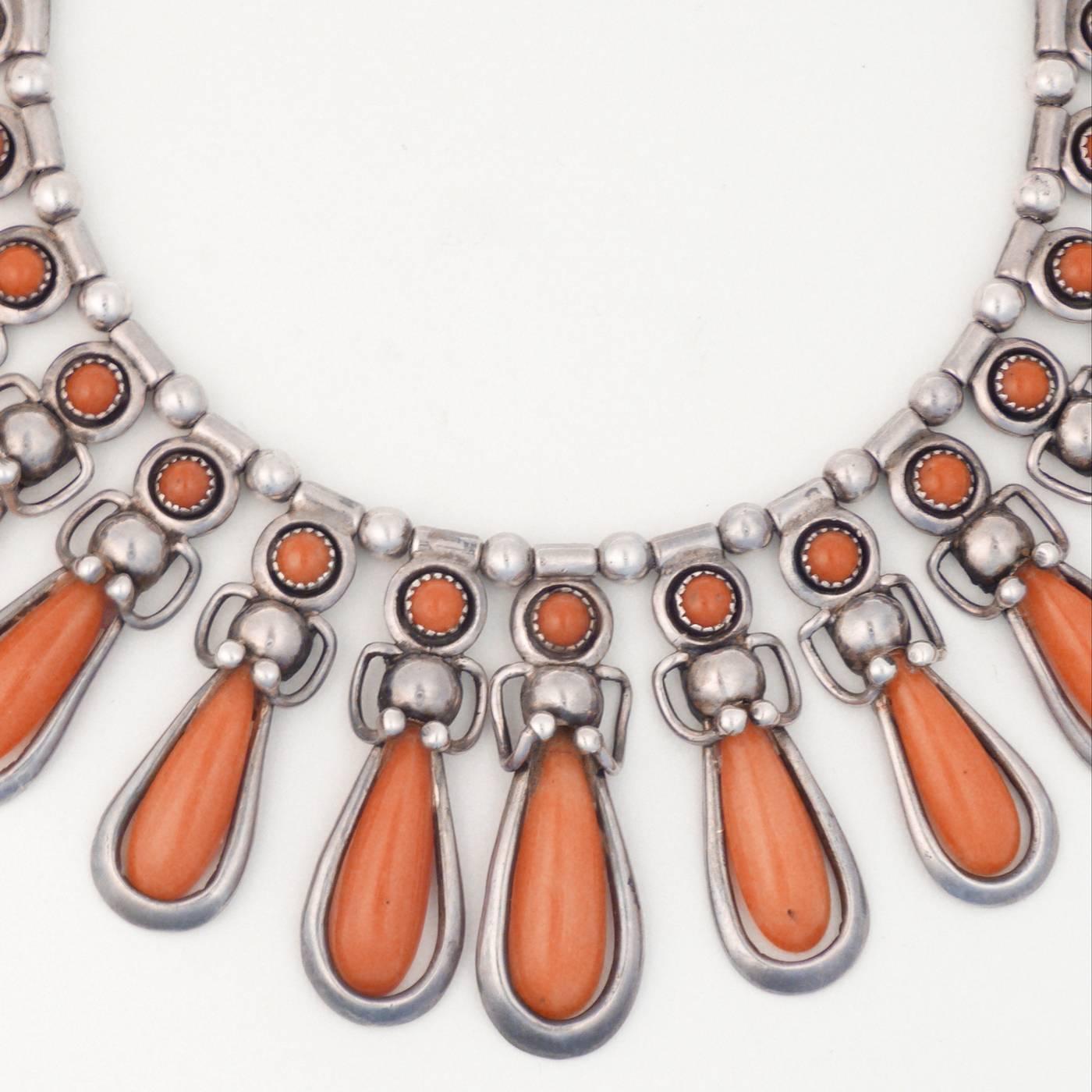 An exquisite coral and sterling silver necklace featuring graduated tear drop shaped pieces of Mediterranean coral. Frank Patania was an Italian immigrant who employed Native American jewelrs in his studio. Clearly stamped on the reverse with his