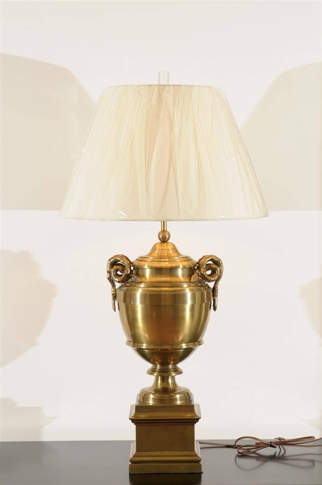 A stunning pair of large-scale vintage brass urn lamps. Heavy cast brass with wonderful detail. The clever vine handle design is a whimsical interpretation/variation of the Classic 