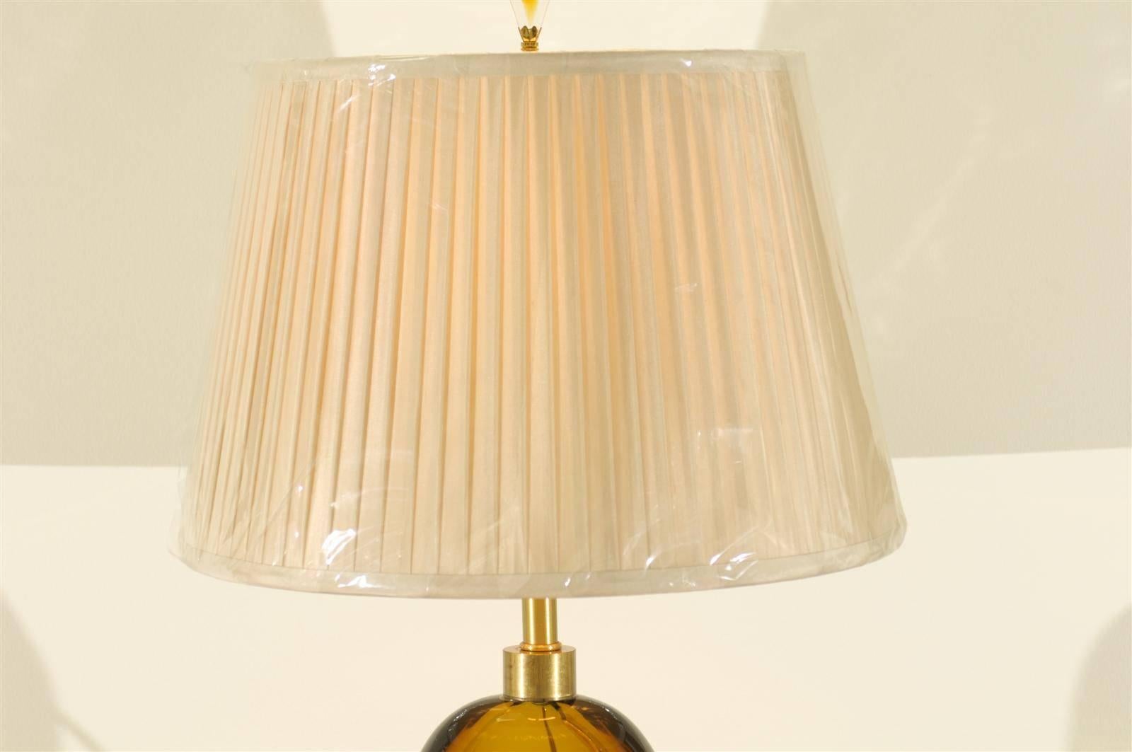 Swedish Exceptional Pair of Restored Amber Glass Lamps by Kosta Boda, circa 1980