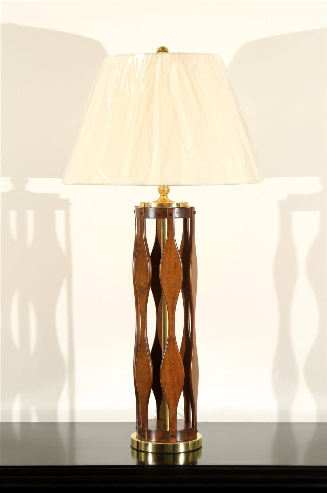 A beautifully conceived pair of large-scale vintage modern lamps, circa 1960. Pierced cylinder form constructed from individual pieces of solid Walnut with Dowel joints. Solid brass accents. Fabulous detail and craftsmanship. Dramatic jewelry!