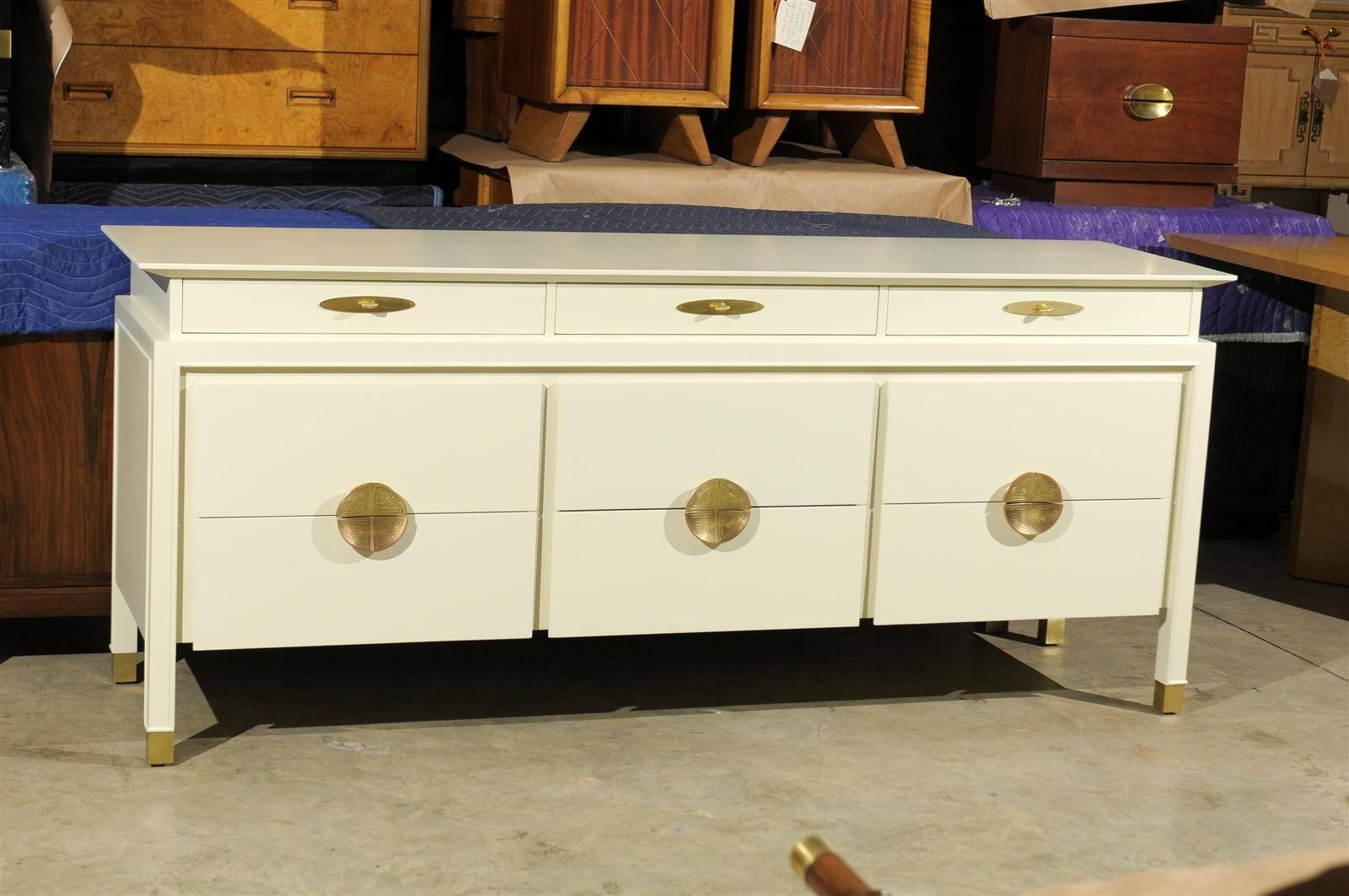 A fabulous, highly unusual nine (9) drawer chest by Johnson Furniture Company, circa 1960's. Exceptional mahogany case construction with lovely detail. Gorgeous solid brass hardware accent the drawers. This chest displays the characteristics found