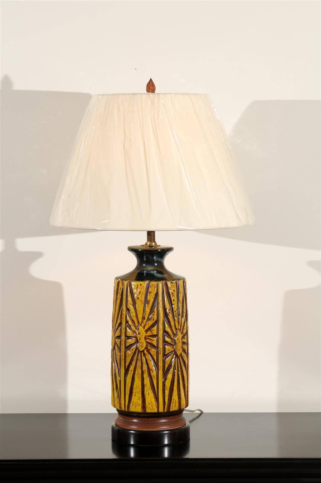 A wonderful pair of large-scale ceramic lamps, circa 1960. Graphic design with fabulous color. Heavy, beautifully made pieces. Exceptional jewelry! Excellent restored condition. Rewired using clear cord; new brass 3-way sockets with brass turn