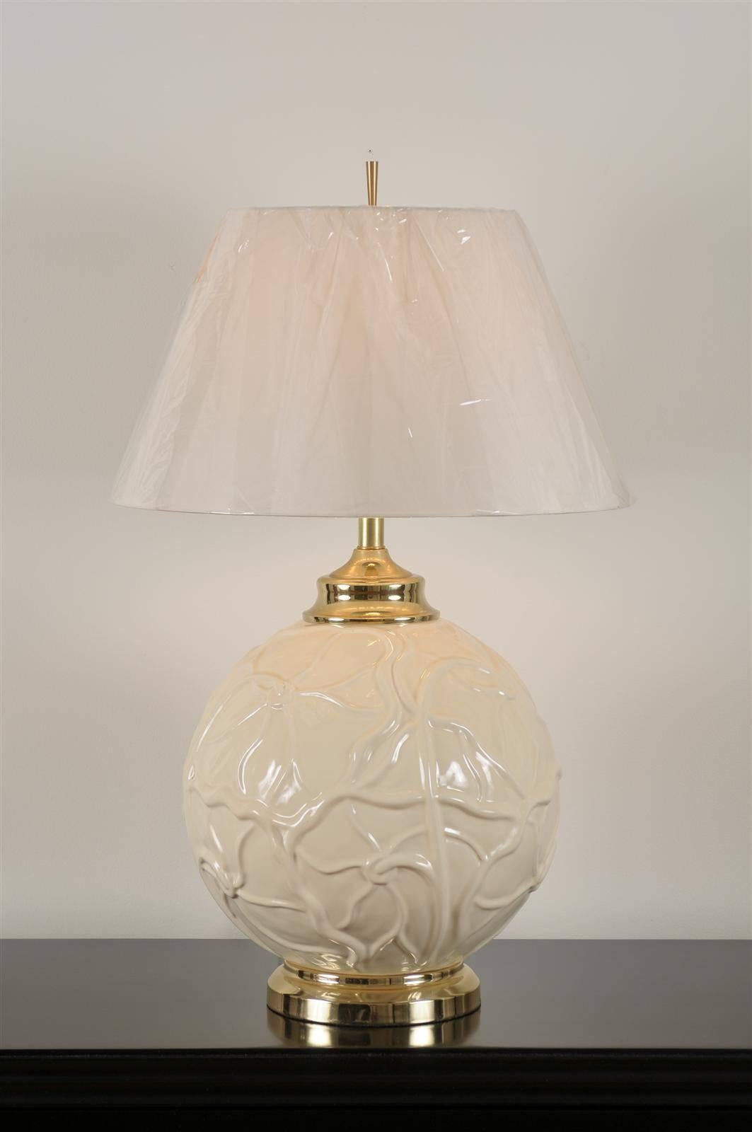 A stellar pair of large-scale vintage ceramic lamps, circa 1970. Fabulous lily pad motif with lovely brass accents. Dramatic jewelry ! Excellent restored condition. Rewired using clear cord; new brass three-way sockets with brass turn switch. The