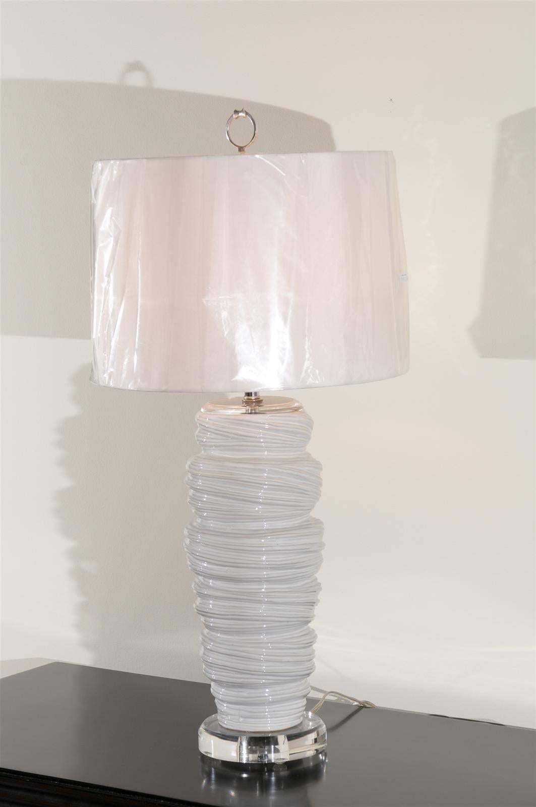 A stunning pair of late 20th century vessels as lamps. Fabulous ceramic form that recalls the look of soft serve ice cream. Beautiful scale and texture. Exceptional jewelry! Excellent restored condition. Wired using clear cord; new nickel three-way