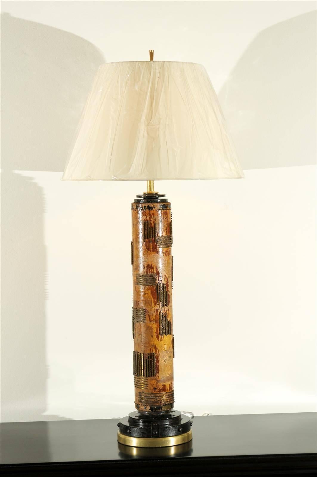 A stunning pair of large-scale vintage wallpaper rollers as lamps, circa 1940. Heavy hardwood cylinder form decorated with solid brass motifs. Accents of lacquered steel and brass. Exquisite jewelry! Excellent restored condition. Rewired using clear