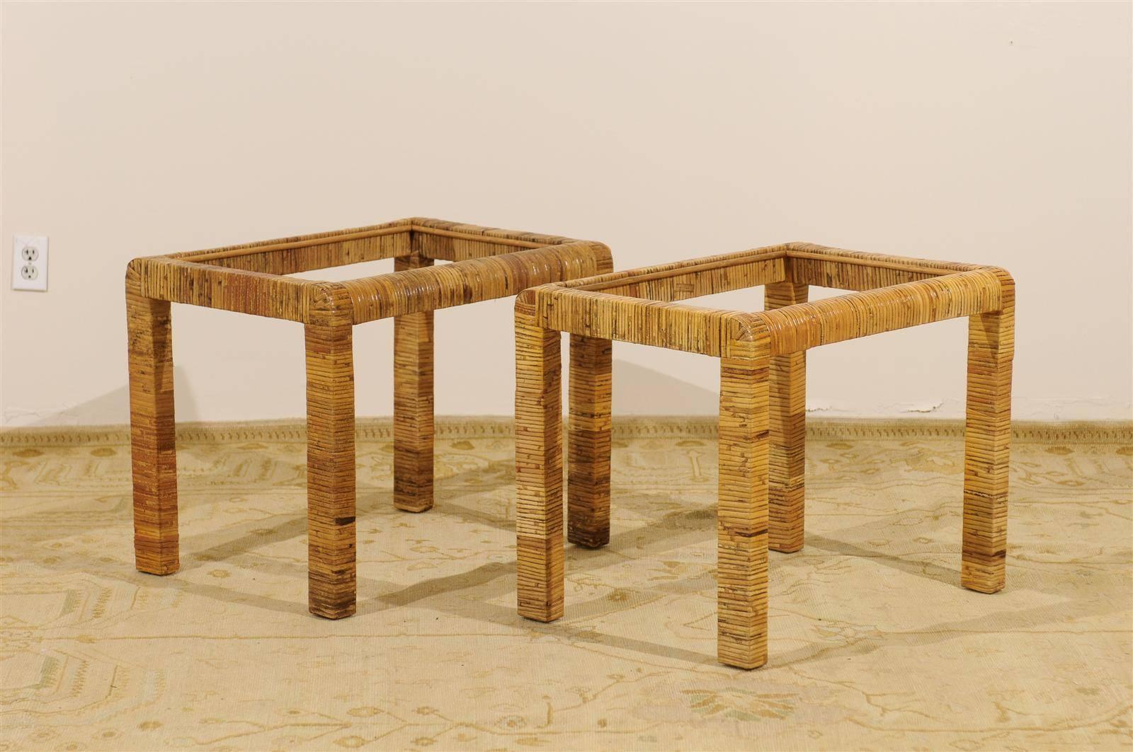 A lovely pair of vintage rattan Parsons style end tables, circa 1970. Stout hardwood frame wrapped in rattan. Exceptional color range, depth and sheen. While unmarked, the tables are consistent with the Bielecky Brothers production of the 1970s.