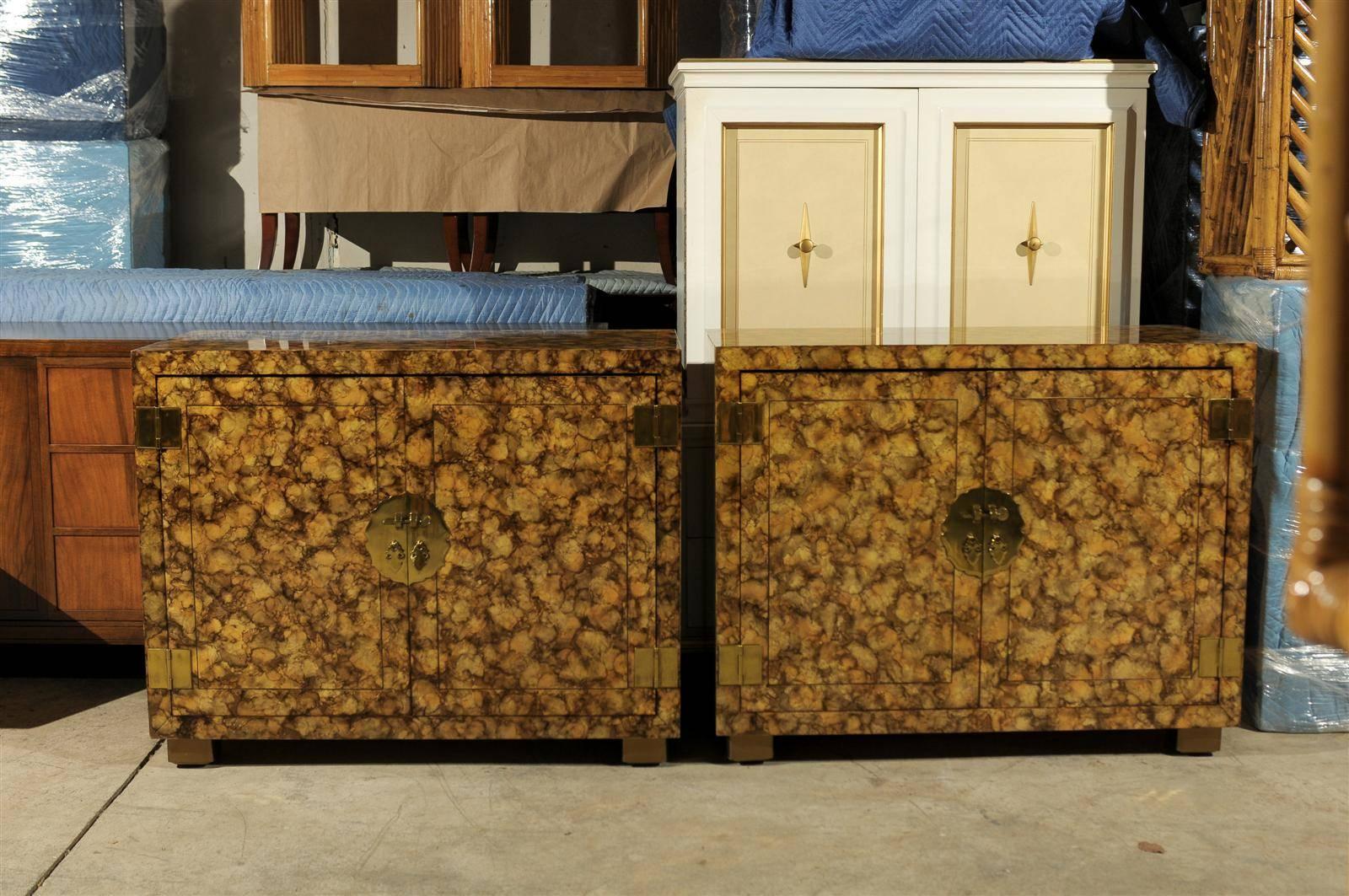 A gorgeous pair of vintage cabinets by Henredon, circa 1975. The unusual finish is created by an oil drop lacquer technique which portrays the look of tortoise shell. Exceptional detail and craftsmanship. Excellent restored condition. The cabinets