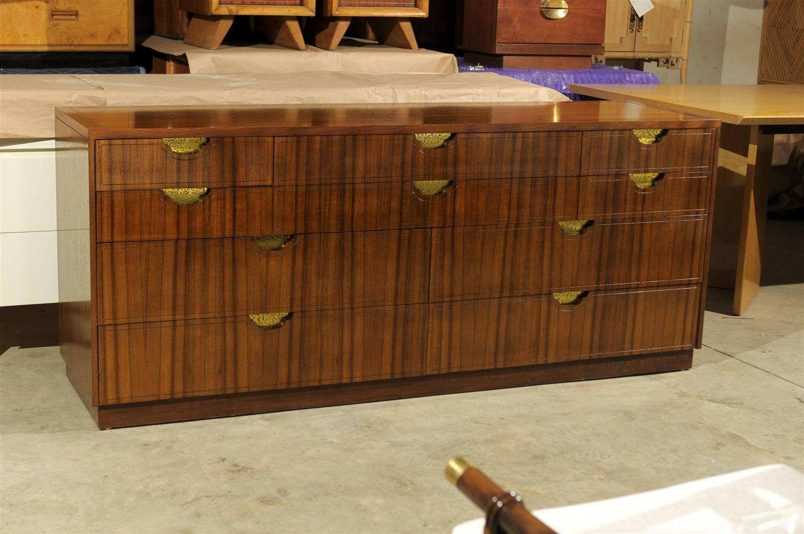 An absolutely stunning modern ten-drawer chest by Baker, circa 1980. Evidently from a limited production series, as research can find no examples like it. Stout, exquisitely crafted walnut case construction. The veneer displays a dramatic zebra-like