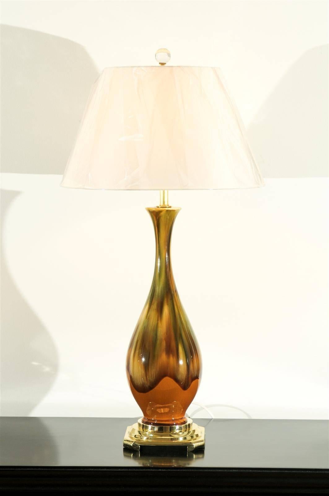 A stellar pair of vintage ceramic lamps, circa 1970. Drip glaze technique with a stunning color combination of yellow ochre, caramel and green. Beautifully crafted pieces with a rich organic quality. Exquisite jewelry! Excellent restored condition.