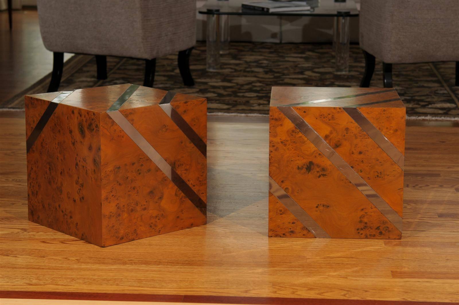 A beautiful pair of vintage cubes. Olivewood veneer over solid hardwood construction with nickel inlay. Finished on all sides, the tables may be rotated to display more or less of the nickel accents. Exquisite design, craftsmanship and materials.