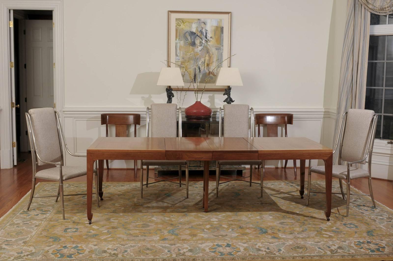 This magnificent dining table is shipped as professionally photographed and described in the listing narrative: Meticulously professionally restored and installation ready. 

A fabulous vintage extension dining table in walnut by Baker Furniture,