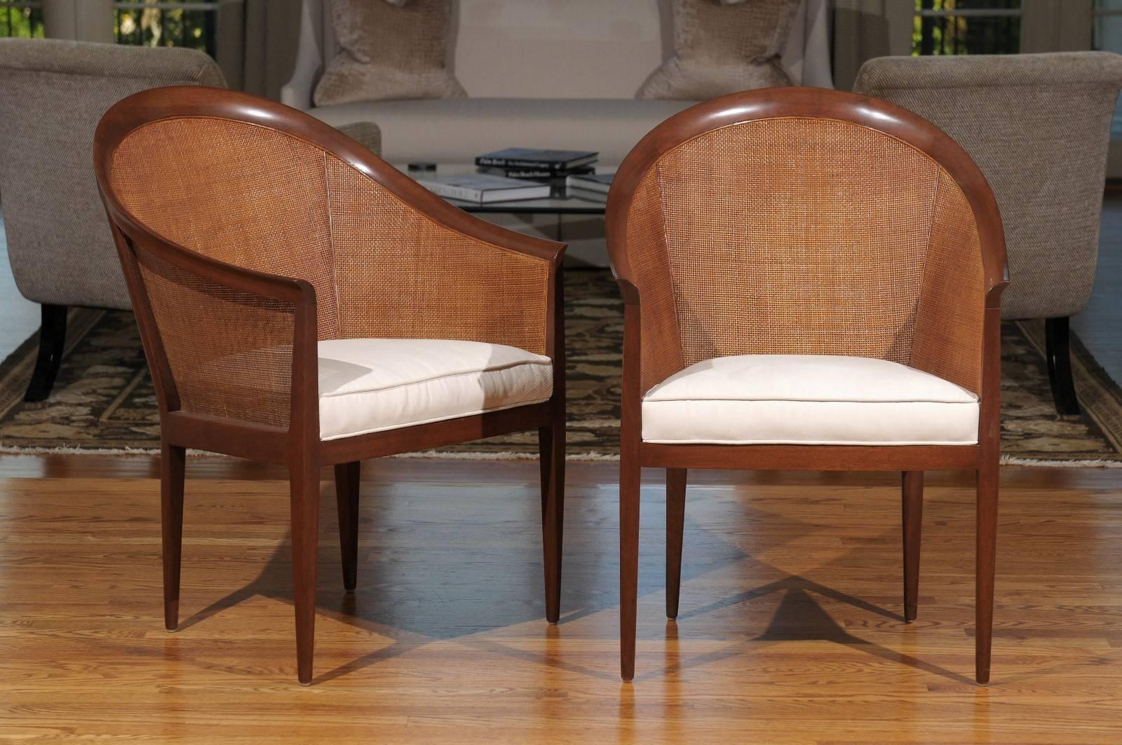 These magnificent chairs are shipped as professionally photographed and described in the listing narrative: Meticulously professionally restored and installation ready. Expert custom upholstery service is available.

A magnificent pair of cane