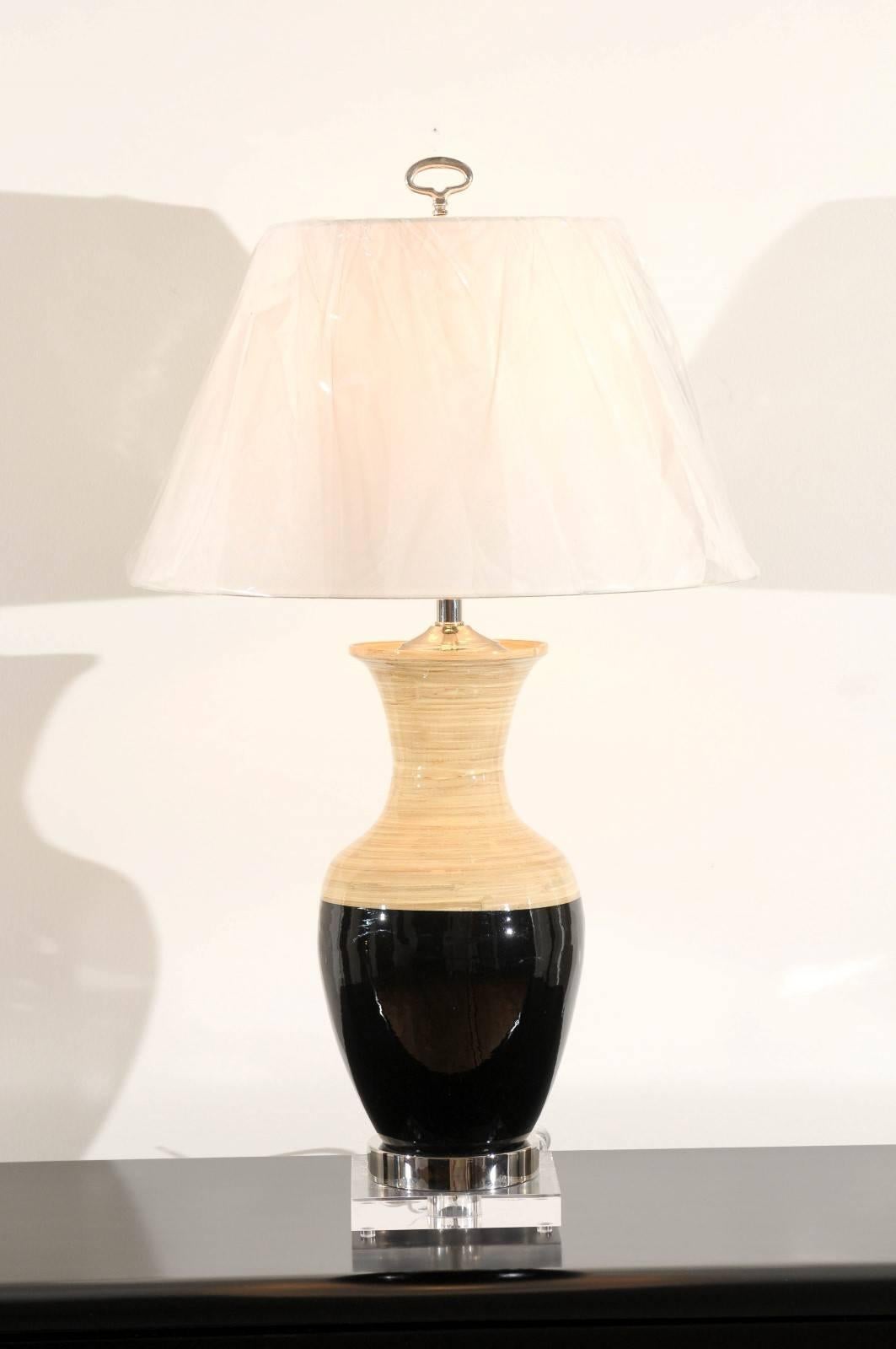 A stunning pair of architectural vessels as custom-made lamps. Beautiful spun bamboo form with black lacquer highlight. Accents in polished nickel and Lucite. Exceptional weight and quality. Exquisite Jewelry! Excellent Restored Condition. Wired