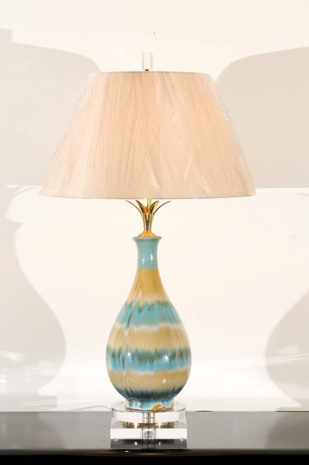 A stunning pair of drip glaze ceramic vessels as custom lamps. Fabulous scale, form and range of color. Lovely solid brass petal neck detail. Exceptional materials and craftsmanship. Exquisite jewelry! Excellent restored condition. Wired using clear
