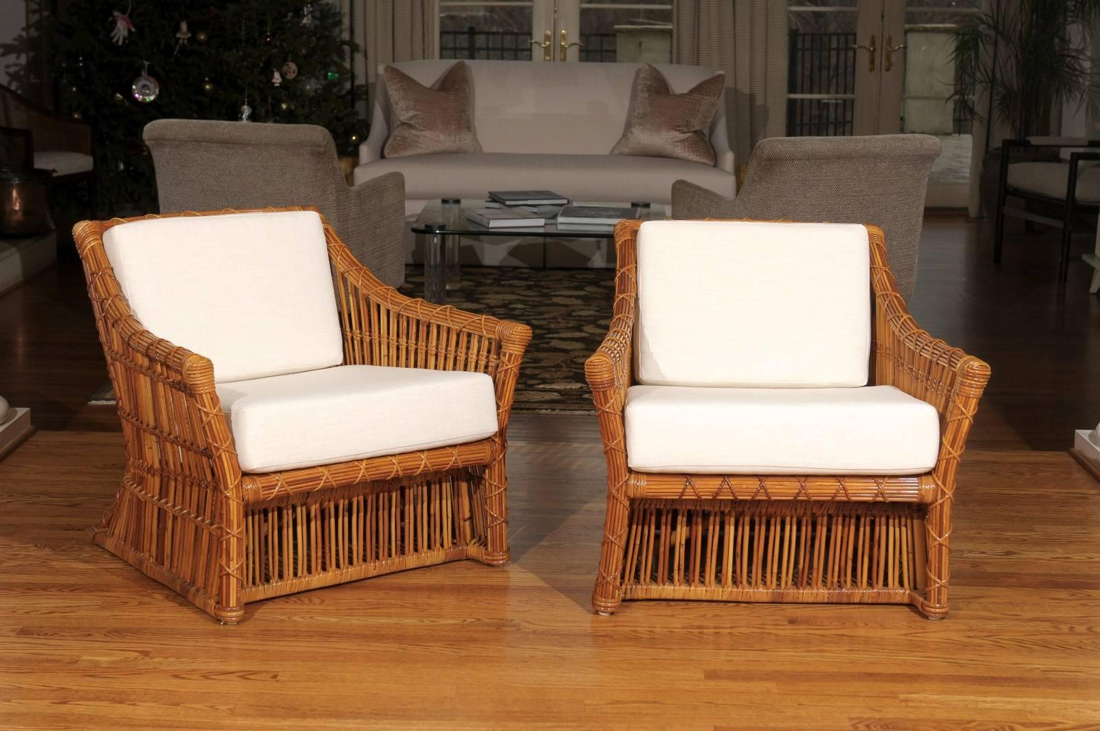 These magnificent lounge chairs are shipped as professionally photographed and described in the listing narrative: Meticulously professionally restored and installation ready. New custom upholstery in a stunning Larsen fabric. Expert custom