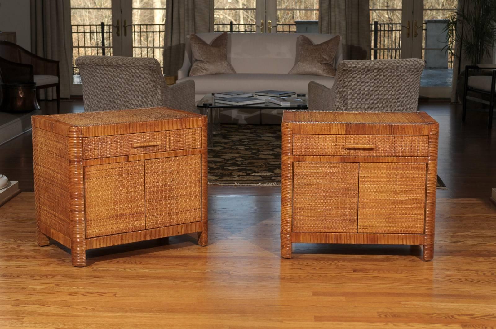 A stellar pair of custom commissioned cabinets by Bielecky Brothers, circa 1975. Expertly made solid hardwood case construction painstakingly wrapped and veneered in cane. Exquisite craftsmanship. Fabulous rhythm and range of color-aged to absolute