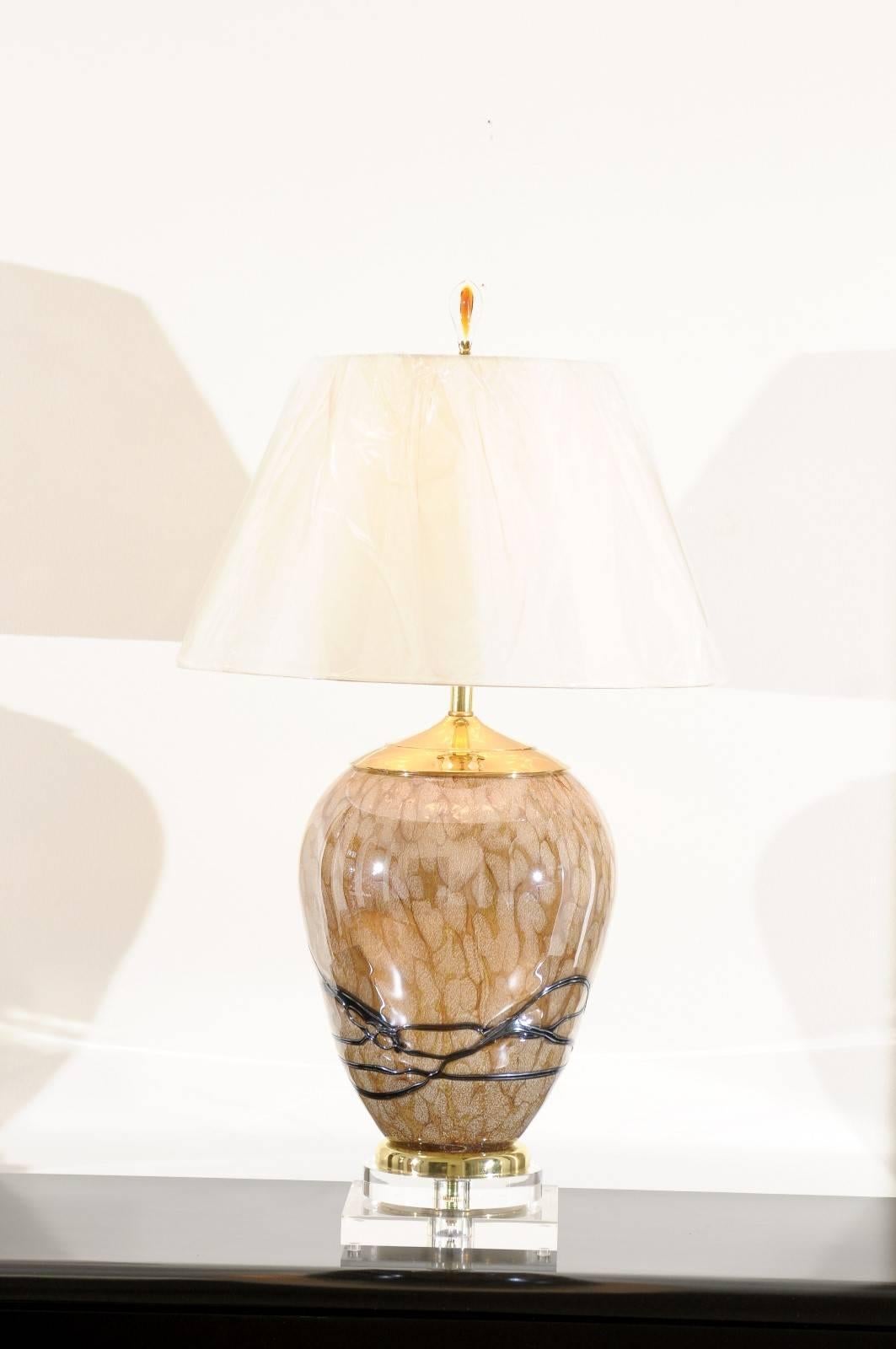 These magnificent lamps are shipped as photographed and described in the narrative. They are custom built using materials of the highest quality and are shipped complete with the new shades, harps and finials shown in the photos.

A stunning pair of