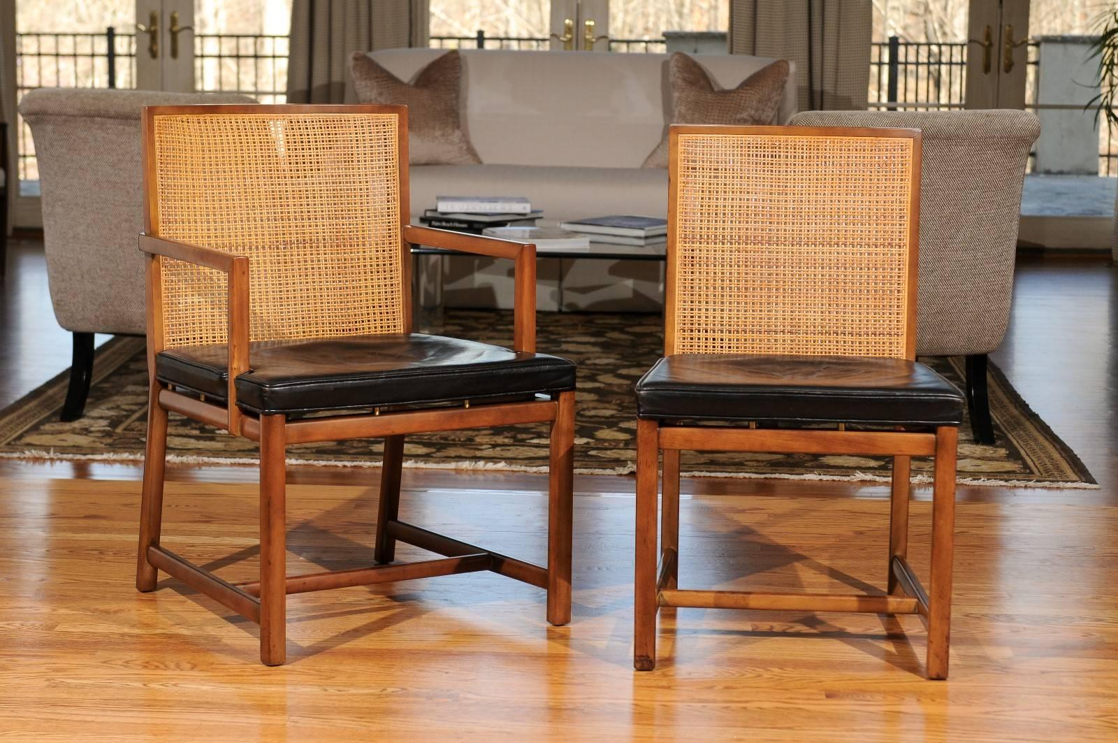 Exceptional examples from a low production series of dining chairs from the boutique New World collection by Michael Taylor for Baker, circa 1960. There are two (2) host and four (4) side chairs. Expertly crafted solid Cherry frame with exquisite