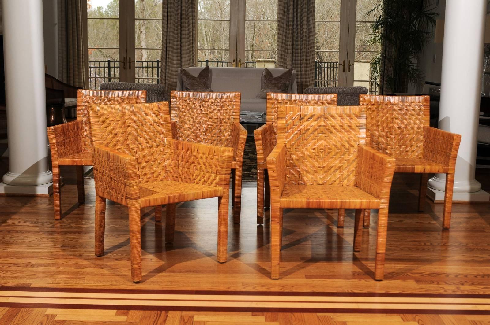 A fabulous set of six difficult to find vintage dining or occasional chairs in the style of Jean-Michel Frank. Heavy solid hardwood construction painstakingly veneered in rattan cane. Beautiful diamond herringbone pattern. Exceptional style,