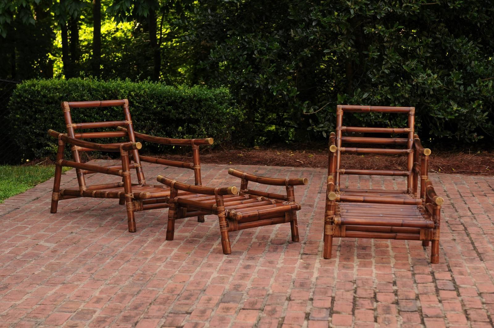 A exceptional restored pair of vintage rattan lounge chairs with matching ottomans, circa 1968. These particular pieces were custom-made for a storied Atlanta interior designer, using the John Wisner for Ficks Reed series as inspiration. The Wisner