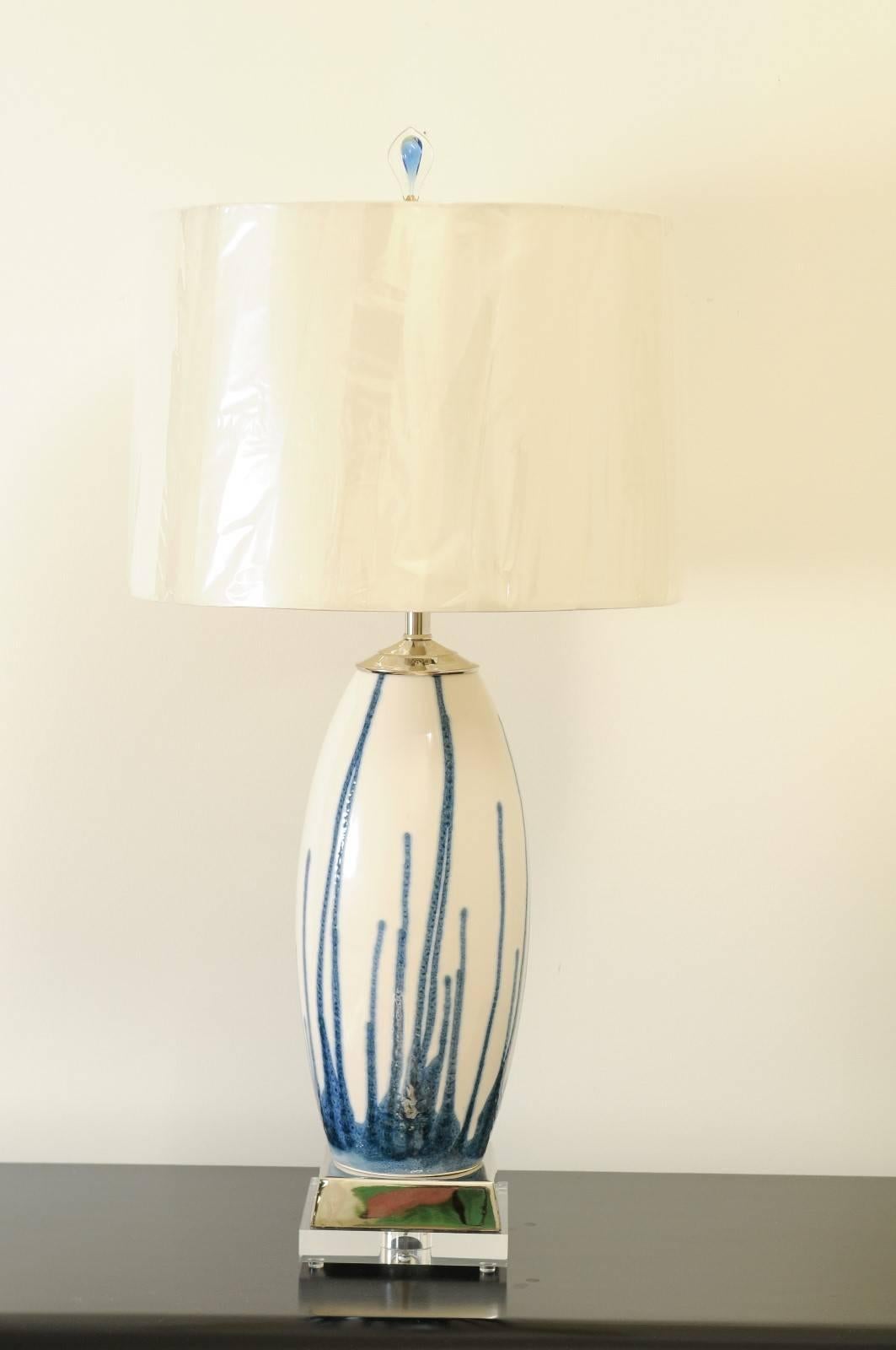 A beautiful pair of handmade Portuguese drip glazed ceramic vessels as custom-made lamps. Fabulous scale and form with accents of polished nickel and Lucite. Custom blown glass finials ice the cake. Exceptionally crafted pieces using components of