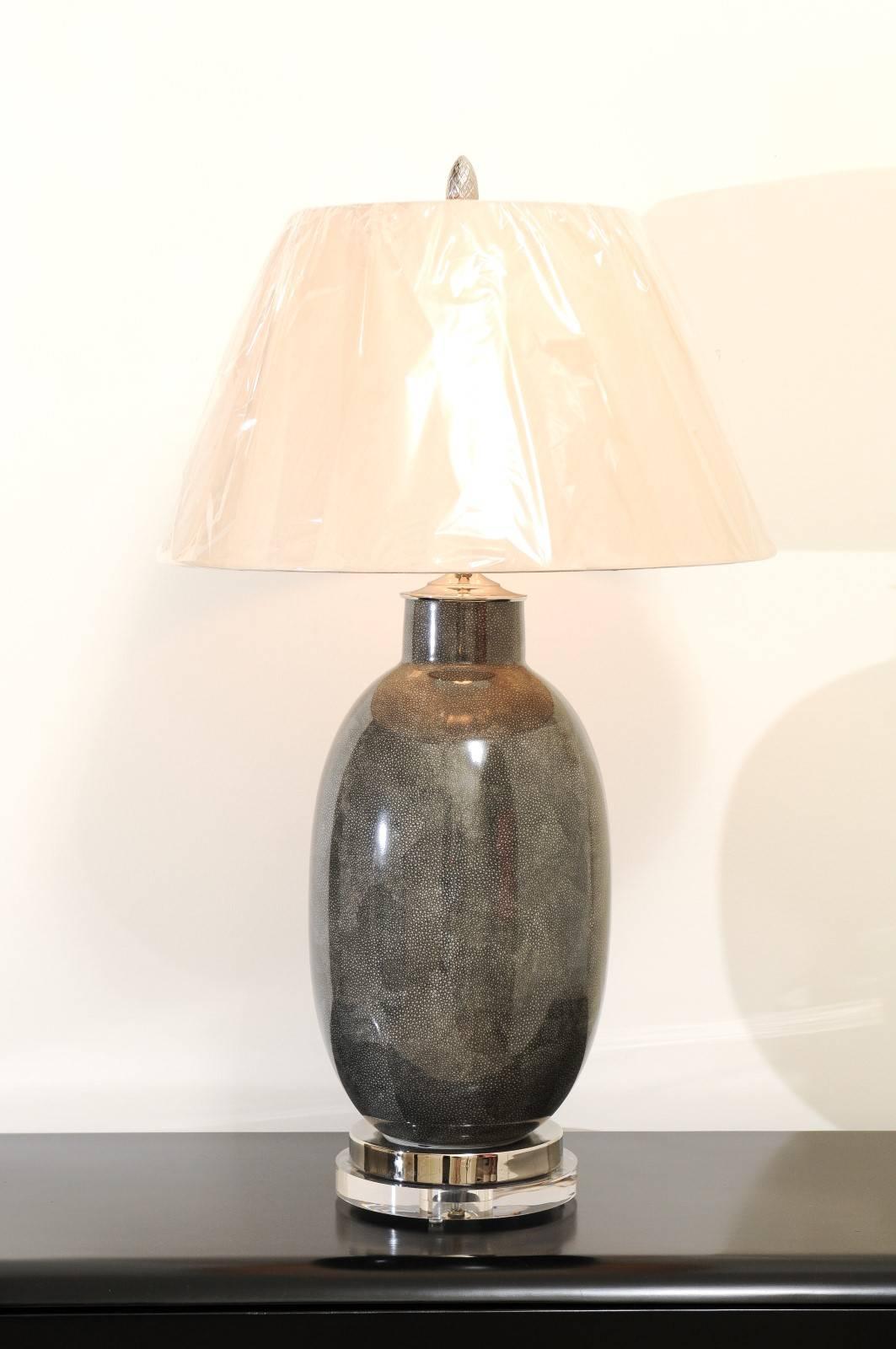 A stunning pair of ceramic vessels as custom-made lamps. Beautiful form and scale with a charcoal colored finish that portrays the look of shagreen. Expertly crafted using components of only the finest quality. Exceptional jewelry! Excellent