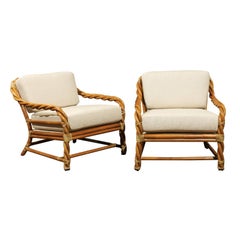 Coveted Pair of Restored Braided Rattan Loungers by McGuire, circa 1980