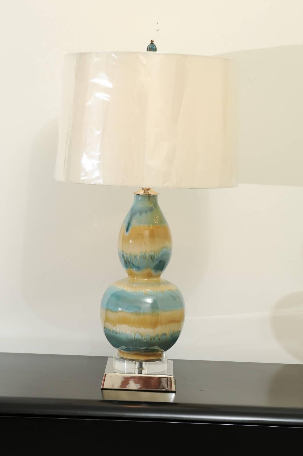 A stunning pair of vintage ceramic drip-glaze vessels as custom-made lamps. Beautiful gourd form with fabulous coloring and sheen. Built using components of only the finest quality. Exquisite jewelry! Excellent restored condition. Wired using clear