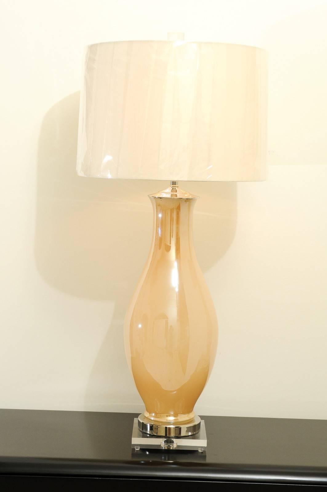 A stellar pair of blown Murano lamps, circa 1960. Exceptional form and scale. Reverse painting provides a beautiful pearl-like, iridescent quality. Sublime craftsmanship. These timeless pieces will blend seamlessly into any interior. Fabulous