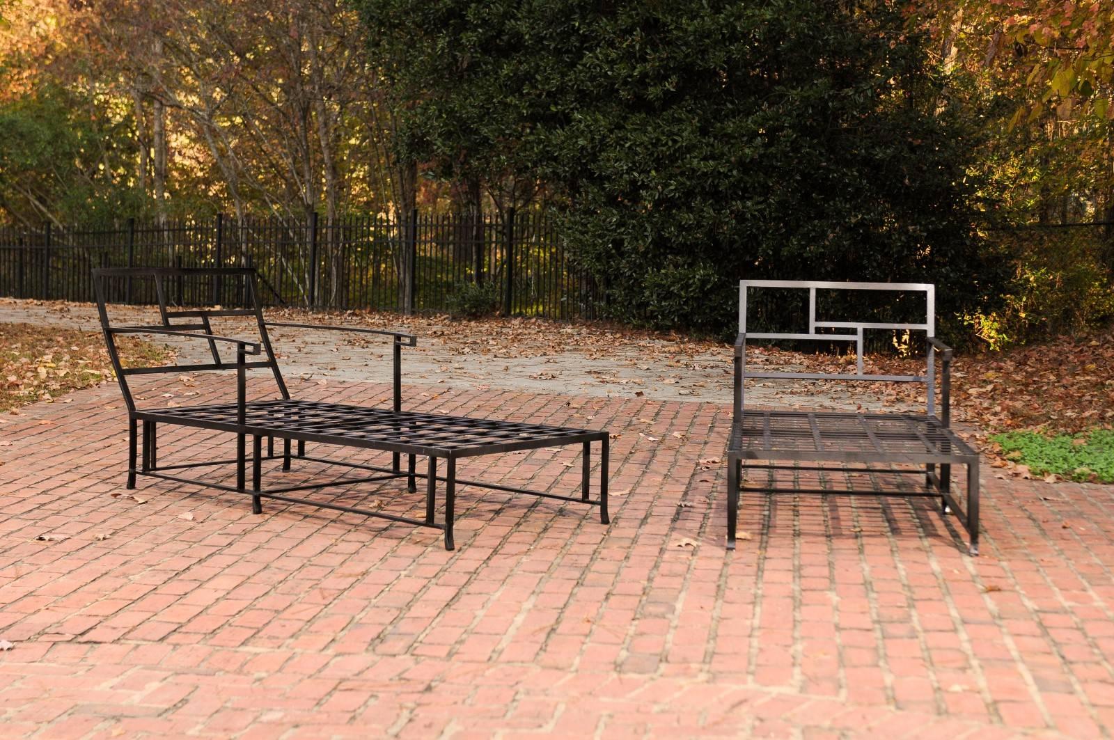 A fabulous pair of wrought iron chaise lounges, circa 1965. Heavy, exceptionally made pieces designed with stunning back and arm details. While suitable for exterior use, these particular chairs have always resided indoors. Stylish pieces made to