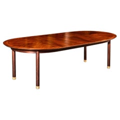 Majestuosa mesa de comedor elíptica de nogal, diseñada por Michael Taylor para Baker, hacia 1958
