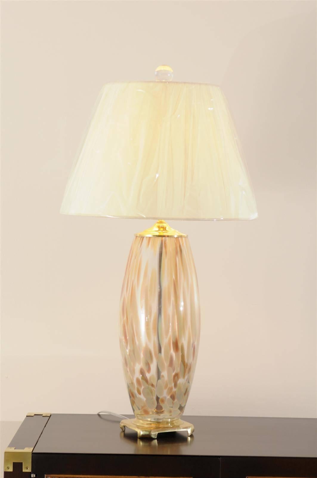 A stellar pair of blown Murano glass lamps, circa 1970s. Beautiful form and color. Exquisite Jewelry! Excellent restored condition. All brass components have been re-plated. Rewired using clear cord, complete with new Spanish parchment shades and