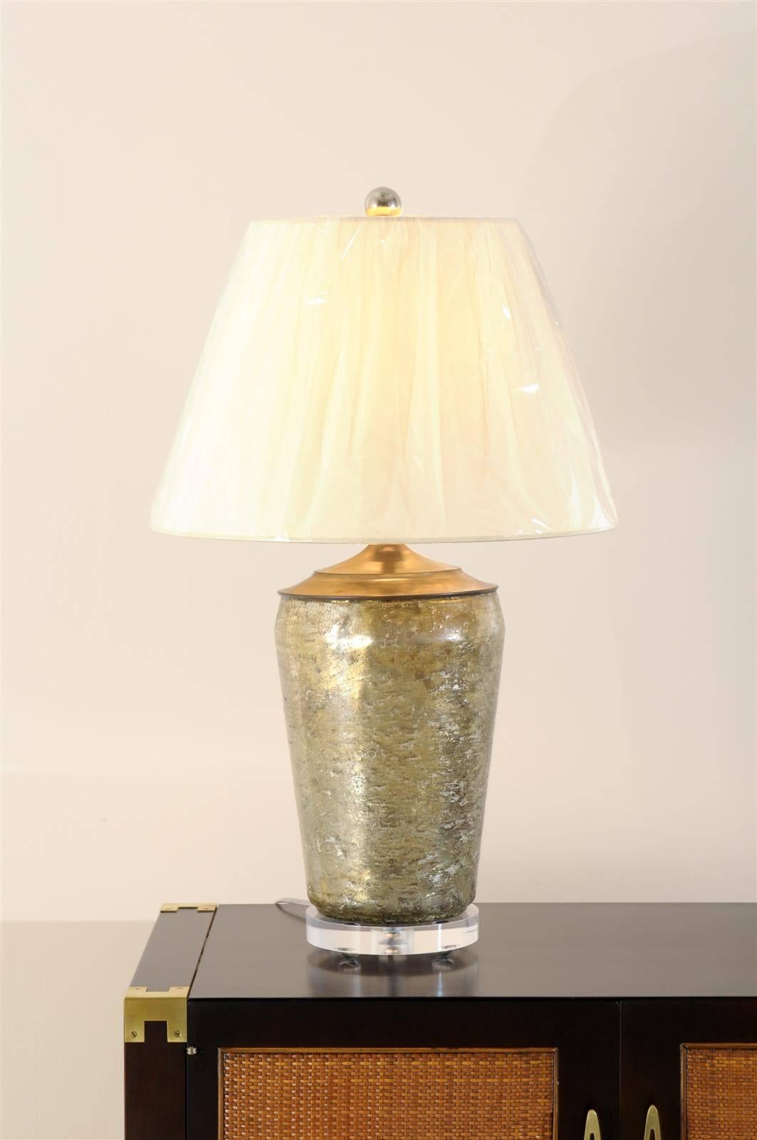 An exceptional pair of vintage Mercury glass lamps, circa 1980's.  Highly functional, as the pieces display both silver and gold qualities.  Exquisite Jewelry !  Excellent Restored Condition.  The lamps have been rewired using clear cord and have
