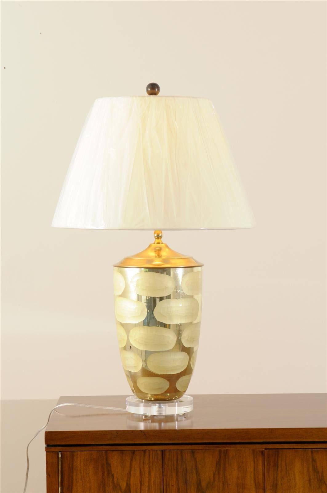 A fabulous pair of vintage Mercury glass lamps.  Highly functional pieces, as they display both silver and gold tones.  Exceptional Jewelry !  Excellent Restored Condition.  The lamps have been rewired using clear cord, new 3-way sockets and new