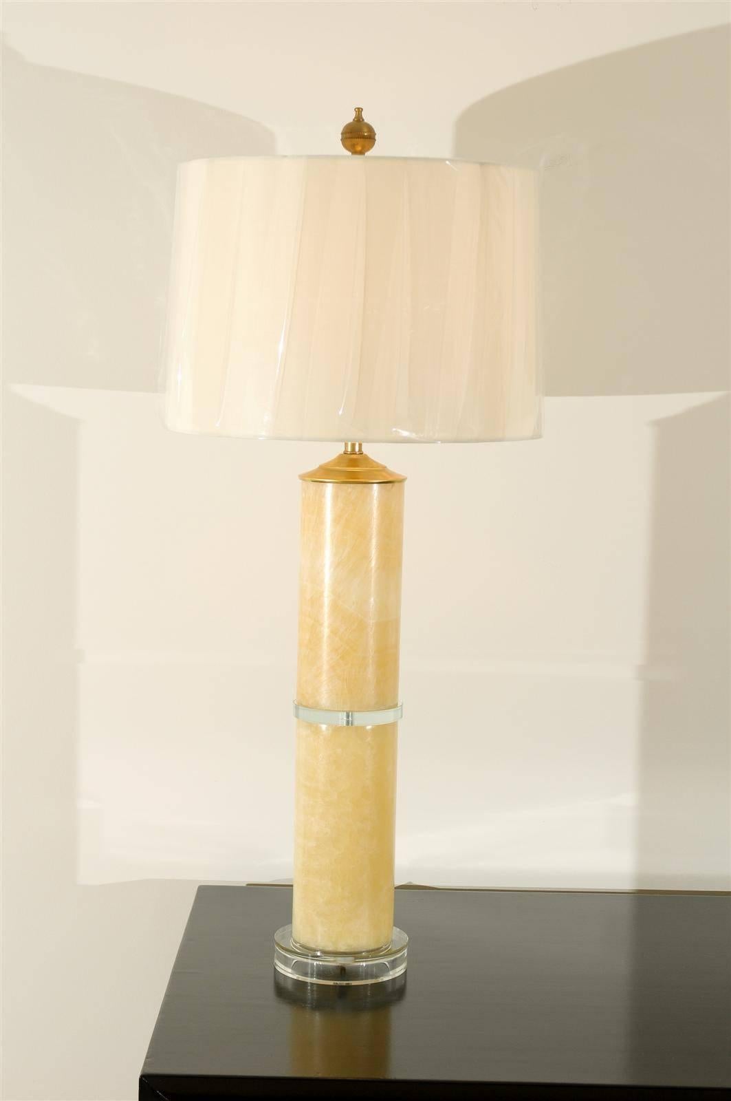 A beautiful pair of marble cylinder lamps, circa 1980s. Fabulous scale and color. Exquisite jewelry! Excellent restored condition. Rewired using clear cord, new three-way sockets with brass turn switch and new glass bases. Complete with new neutral