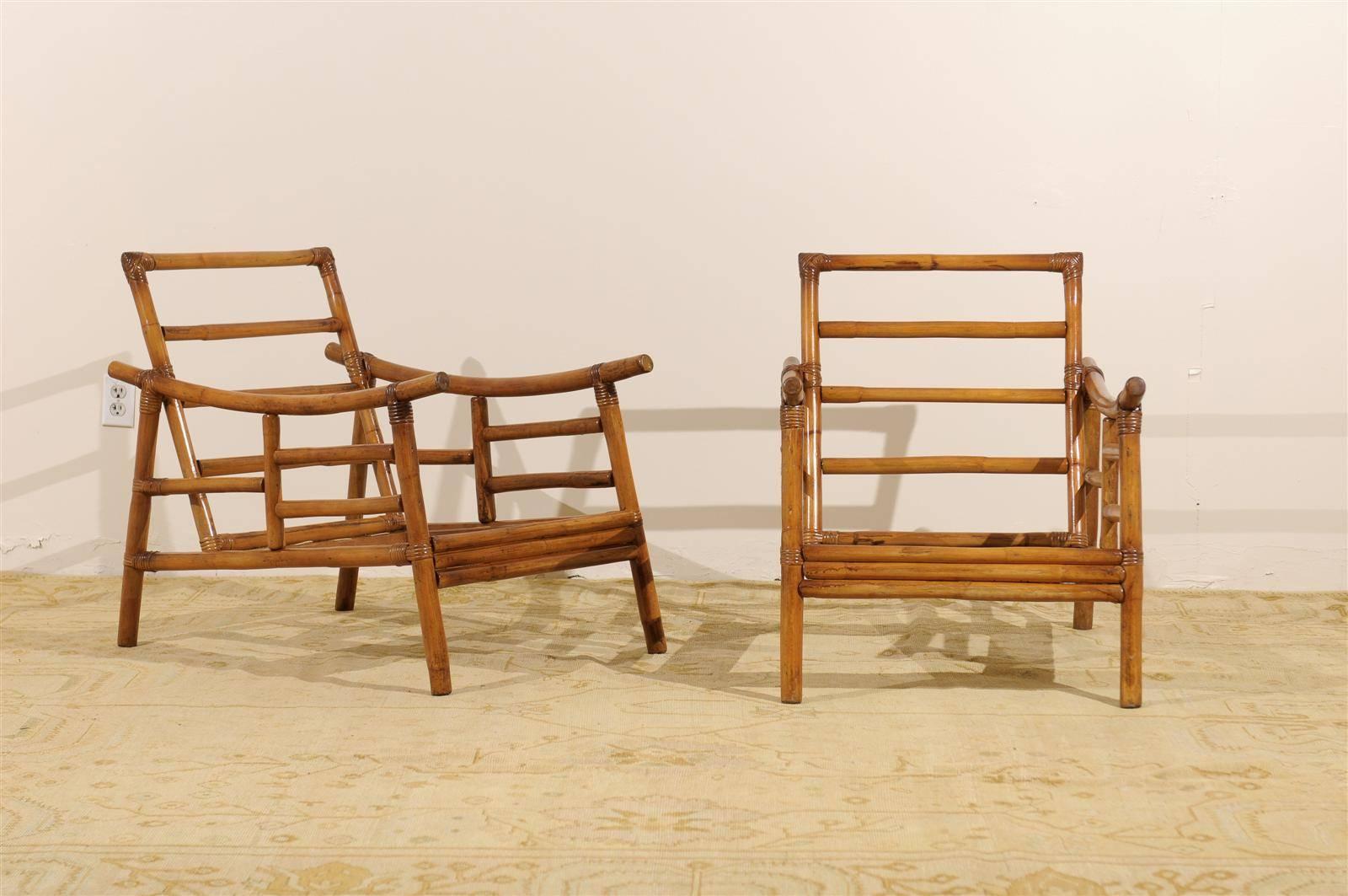 An exceptional pair from a difficult to find series of vintage Campaign style lounge chairs. Rattan and hardwood construction with beautiful raffia binding detail. Stout, comfortable and expertly made. Aged to absolute perfection ! These unusual
