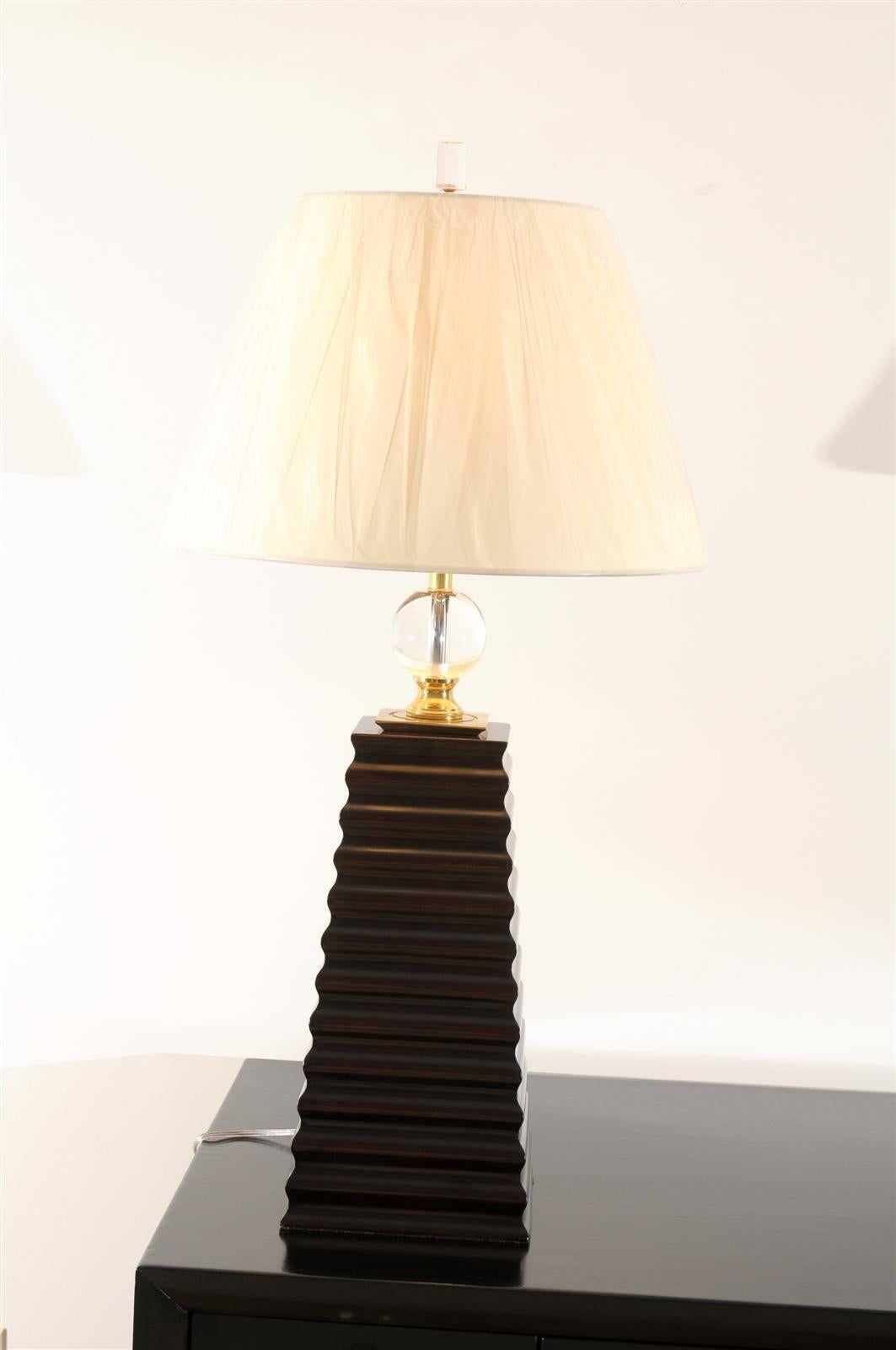 A spectacular pair of large-scale carved wood Obelisk lamps, circa 1980s. Heavy, solid wood form finished in Espresso lacquer with solid brass and crystal accents. Beautifully made pieces with style and detail. Exceptional jewelry for any room!