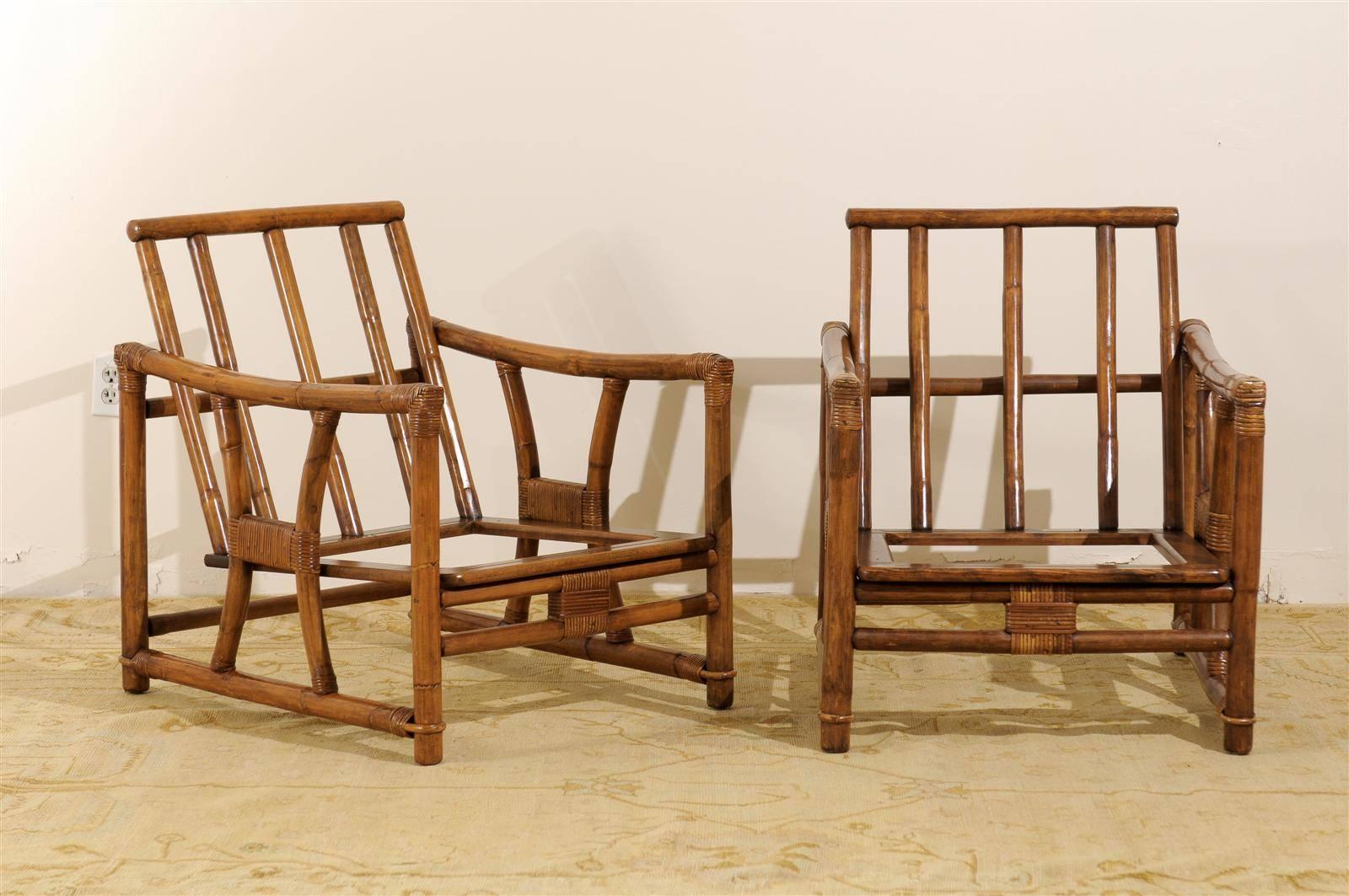 A killer pair of vintage lounge or club chairs by Ficks Reed, circa 1960s. Rattan and hardwood construction with beautiful raffia binding detail. Aged to absolute perfection! Stout, comfortable and expertly made. A fabulous conduit to introduce