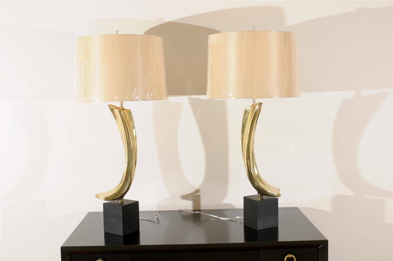 These magnificent lamps have been professionally restored and are shipped as professionally photographed and described, complete with new shades, harps and finials.

An exceptional pair of lamps by Laurel, circa 1970. Fabulous cast metal sculpture