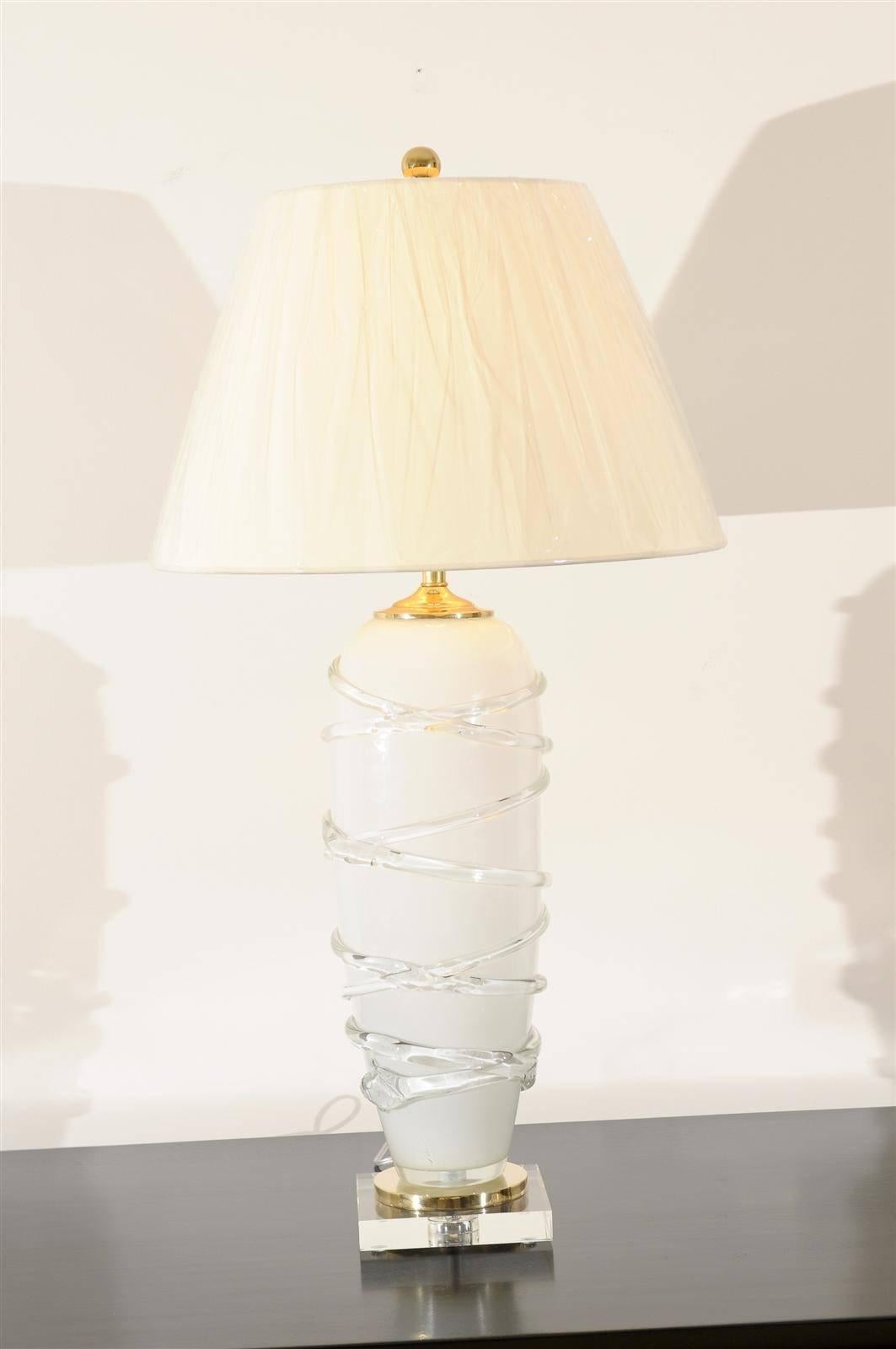 These magnificent lamps have been professionally restored and are shipped as professionally photographed and described. Complete with new shades, harps and finials.

A stunning pair of cream opaque blown glass lamps, circa 1980. Beautiful glass
