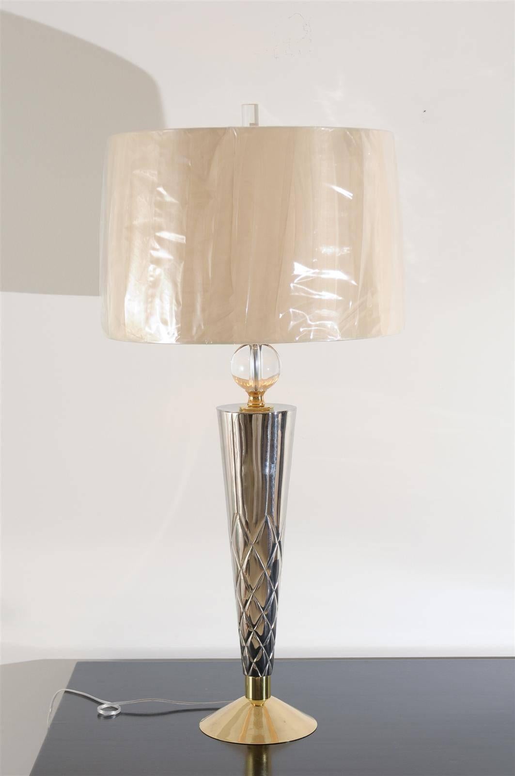 An exquisite pair of vintage tornado style lamps, circa 1960. Crystal ball atop solid bronze structure, components finished in nickel and brass. Exceptional weight, detail, quality and scale. Sublime jewelry! Excellent restored condition. Rewired