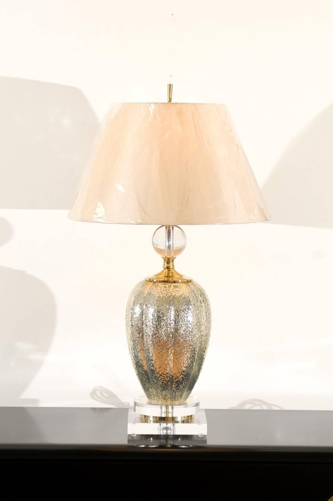 A lovely pair of vintage blown mercury glass vessels as custom-made lamps. Fabulous form and texture built using only the finest quality components. Dramatic pieces that are also functional in establishing the use of both gold and silver tones in a
