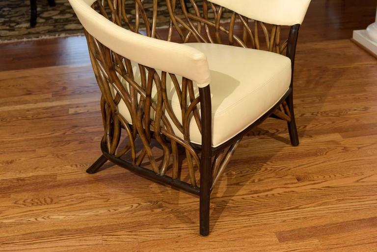 Stunning Pair of Rattan Club Chairs in Parchment Leather For Sale at